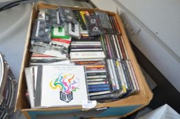 ~100 CDs and Cassette Tapes