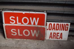 3x Slow Signs with Framed plus One Without, and a Loading Area Sign