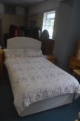 Electric rise and recline 4ft width bed with headboard and bedding