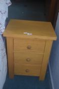 Solid oak three drawer bedside cabinet