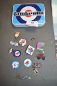 Small tin containing metal ‘mod’ themed badges