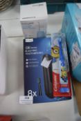 * Barber Boss Water Flosser, Electric Toothbrush Heads 8pk, and a Colgate Toothbrush