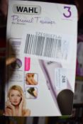 * Wahl Personal Trimmer and a Bauer Pro Ceramic Hair Straightening Brush