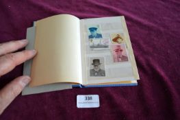 Blue Book Containing a Collection of Various Stamps