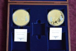 Two limited edition gold-plated proof commemorative medallion sets comprising Portraits of a