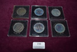 Six Royal Commemorative Crown Coins – A collection of six Royal commemorative crown-size coins,