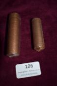 Two Rolls of British Bronze Coinage – Two wrapped rolls of British bronze coins, 1/2p and pennies
