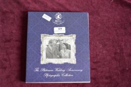 Part-complete Portraits of Queen Elizabeth II Through the Decades commemorative coin collection in