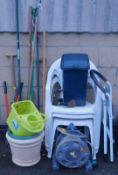 A quantity of gardening equipment, including hedge cutters, hosepipe with reel, garden chairs, a