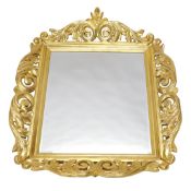 A 1970s Polish German carved cherrywood mirror, in the rococo style, with heavily carved scroll