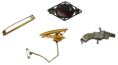 Four items of novelty jewellery, comprising a cannon bar brooch, on a single pin back with safety