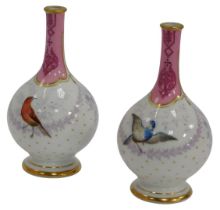 A pair of late 19thC porcelain bottle shaped vases, each decorated with birds below a pink neck,
