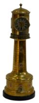 A late 19thC French brass cased lighthouse clock, the revolving top having traces of silver plating,