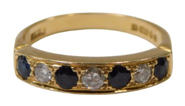 An 18ct gold sapphire and diamond half hoop dress ring, set with four round brilliant cut