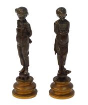 After Auguste Louis Lalouette. A pair of bronzes, each depicting a boy wearing dungarees bearing a