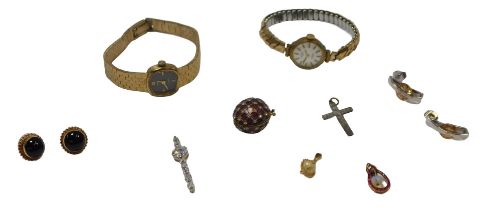 A group of costume jewellery, comprising a Faberge style enamel iris pendant egg, a garnet and