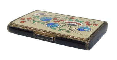 An early 20thC French silver and champleve cigarette case, the lid decorated with Iznik style