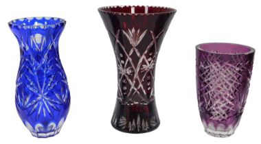 A Bohemian style ruby flashed glass vase, of waisted form, 24cm high, a similar blue flash vase,