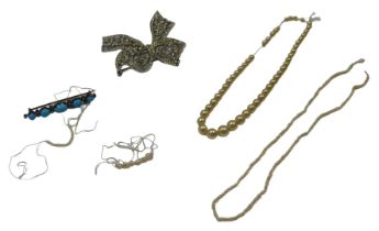 Costume jewellery, comprising an imitation turquoise bar brooch, 4.5cm wide, two strings of