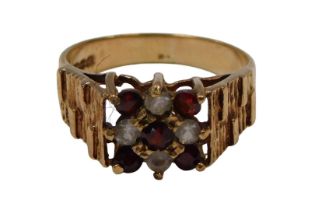 A 9ct gold cluster ring, set with czs and garnets, formed as a cluster, with moulded and raised