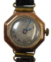 A 1950s 9ct gold cased wristwatch, with an octagonal dial and silvered Roman numeric face, with blue
