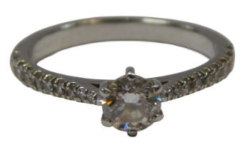 A Diamond Shop engagement ring, with a round brilliant cut diamond, 5.2mm x 5.2mm x 2.8mm, with nine