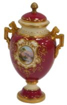 A Coalport porcelain vase and cover, painted with loch scenes, within ovals, surrounded by a cream