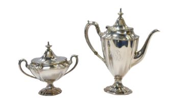 A William IV silver twin handled sugar bowl and cover, of urn form, initialled, raised on a shaped