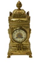 An early 20thC brass cased Renaissance Revival style mantel clock, with pineapple knopped finial,