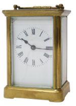 An early 20thC French brass-cased carriage clock, with a white enamel dial having Roman numerals,