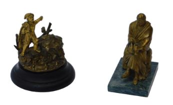 A 19thC gilt metal inkwell, in the form of a fisher boy with nets over his shoulder, on the