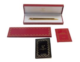 A Must de Cartier Paris Stylo Bille ballpoint pen, serial number 489297, in a fitted case,