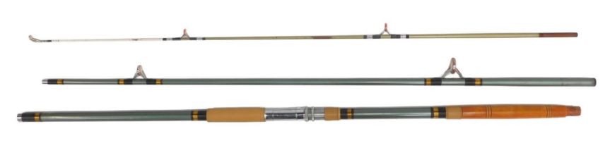 A 1960s three-piece fibreglass boat fishing rod, with porcelain ring liners, and with original