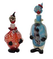 Two glass clown decanters, one in predominantly blue mottled and black glass, 40cm high, the other