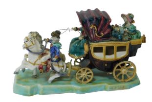 A 20thC art pottery polychrome group, of carriage and figures, bearing indistinct signature, 16cm