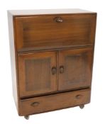 A 20thC Ercol Windsor model 469 cocktail cabinet, of rectangular form with visible dovetails and