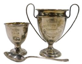 A George V silver miniature trophy, with plain shaped handles, inverted egg shaped body, and