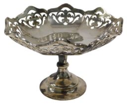 A George VI silver footed bonbon dish, with flared floral rim, on inverted stem and circular foot,