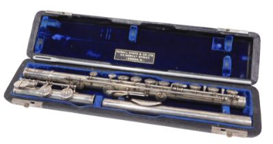 An Elizabeth II three piece silver flute, with articulated stops, numbered 8921 and marked Rudall