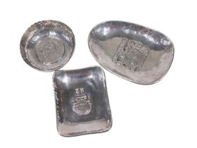 An early 20thC Peruvian dish, of egg shaped form, with hammered border and raised central