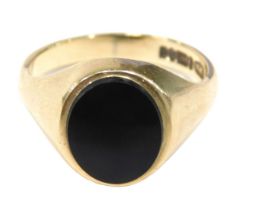 A 9ct gold signet ring, the oval polished black jet ring head, on yellow metal band, by CPS,