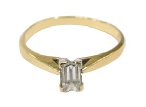 An 18ct gold diamond solitaire ring, set with baguette cut diamond, 5.2mm x 3.2mm x 2.8mm, totalling