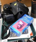 A Canon EOS 650 SLR camera, cased, together with a Jessops 280AF flash, and various instruction