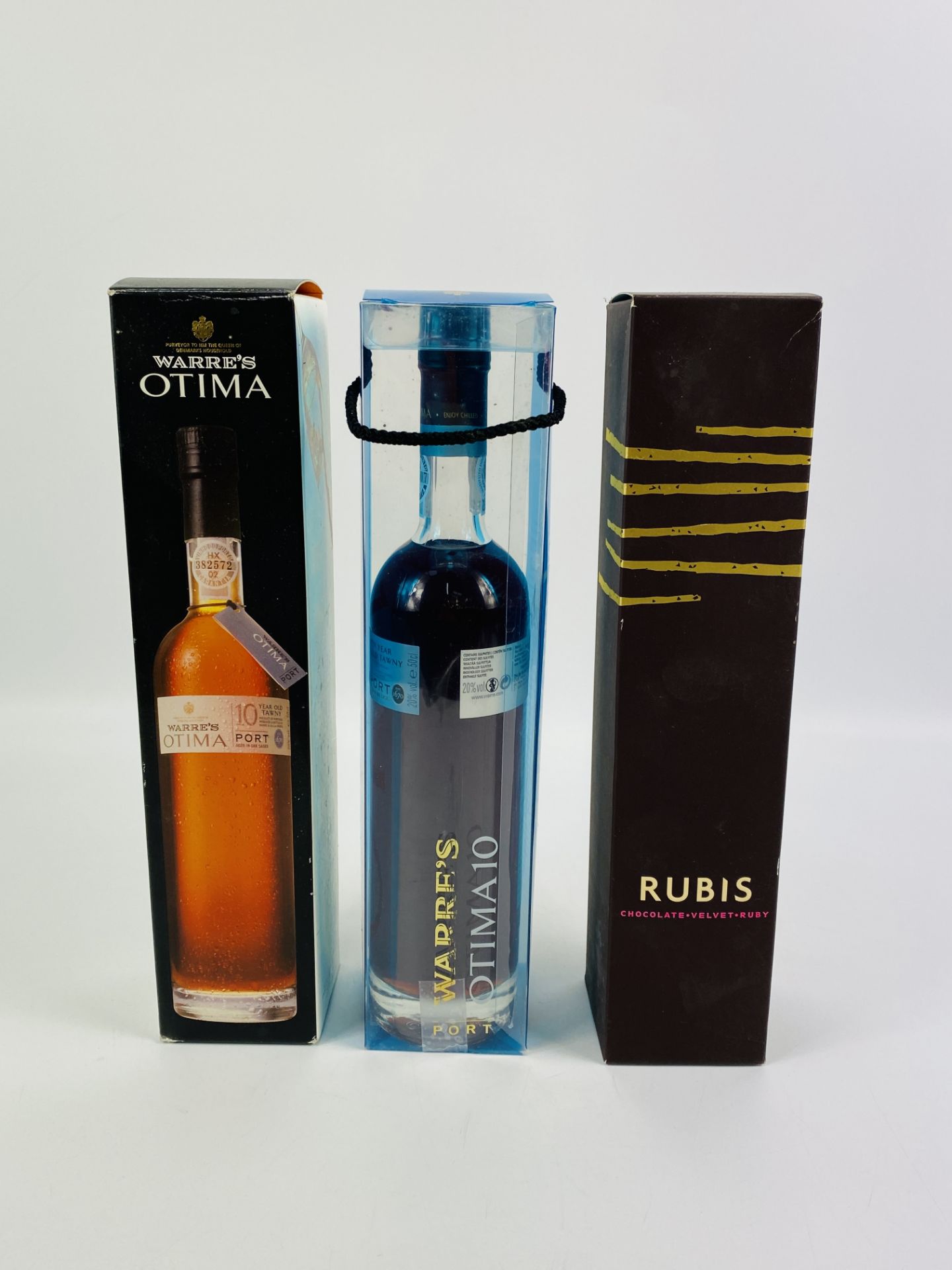 Two 50cl bottles of Warres Otima Port; together with a 50cl bottle of Rubis