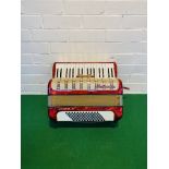 A mid century 'Hohner Arietta IM' piano accordion with hard travel case