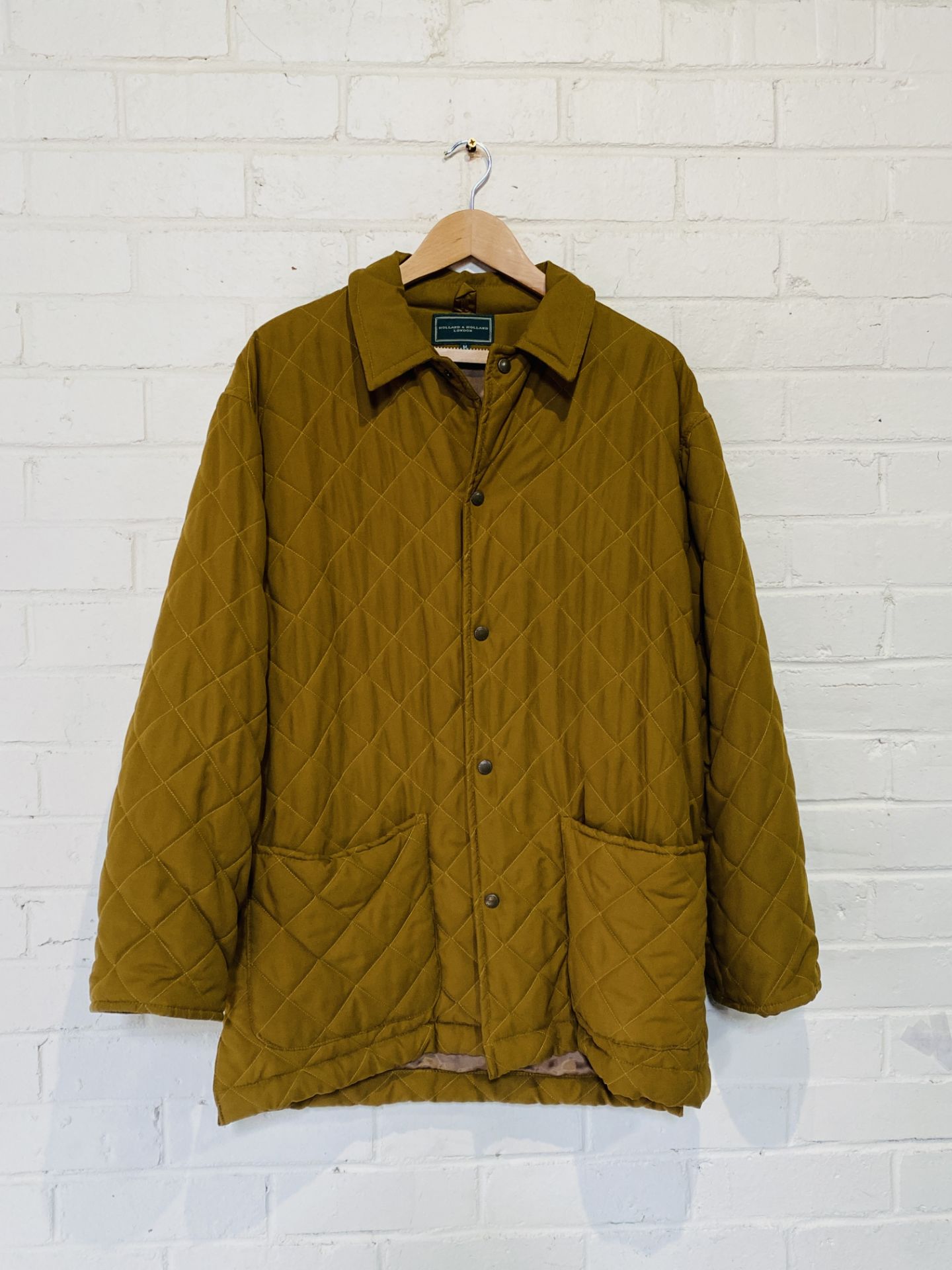 A Holland and Holland quilted coat