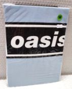 1 x Oasis Band T-Shirt - Colour: Blue - Size: Medium - New in Sealed Packet - CL720 - Location: