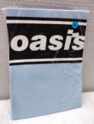 1 x Oasis Band T-Shirt - Colour: Blue - Size: Large - New in Sealed Packet - CL720 - Location: