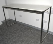 1 x High Leg Rectangular Breakout Table Workstation Featuring Chrome Legs Supporting a White Worktop