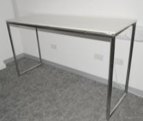1 x High Leg Rectangular Breakout Table Workstation Featuring Chrome Legs Supporting a White Worktop